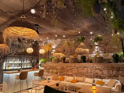 a restaurant with couches and tables in a room at Resort Serra Nature - Luxury Villas Hotel Boutique in Serra