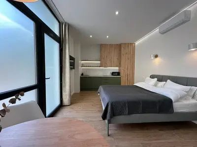 a bedroom with a bed and a large window at Apartamentos Nou Mestalla in Valencia