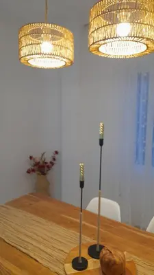 a wooden table with two lights and two microphones at La Terracita de Carrica in Peñalba