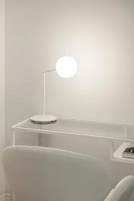 a white table with a light on top of it at Designer apartment facing the sea in Valencia