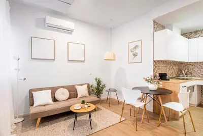 a living room with a couch and a table at Balandra, Lovely flat close to center in Valencia