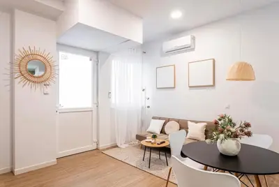 a living room with a table and a couch at Balandra, Lovely flat close to center in Valencia
