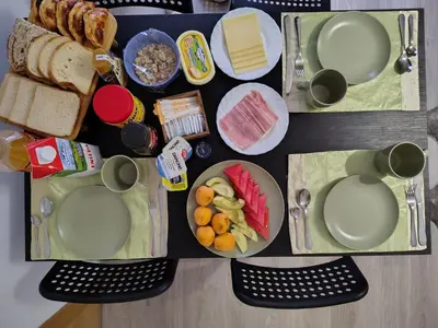 a table topped with plates of food and bread at Agui House in Valencia