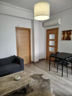 a living room with a couch and a table at Agui House in Valencia