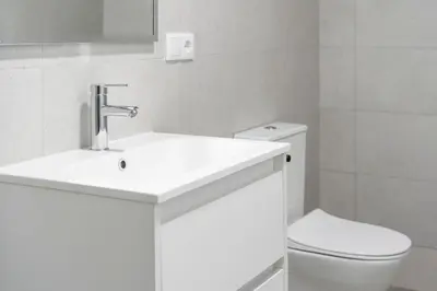 a white bathroom with a sink and a toilet at VLC Host - Sumsi in Valencia