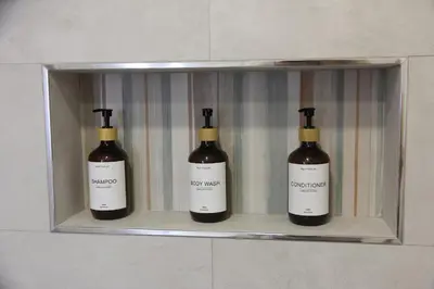 three bottles of wine sitting on a shelf at Ruzafa Acquamarina in Valencia