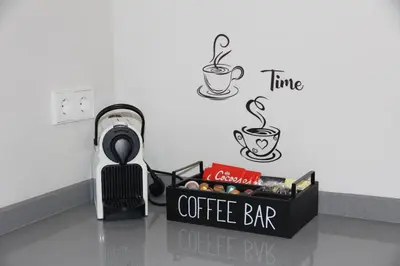 a coffee bar sign on a counter with coffee cups at Ruzafa Acquamarina in Valencia