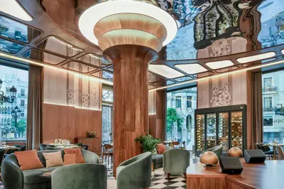 a lobby of a hotel with a large ceiling at Grand Hotel Centenari, Valencia, Autograph Collection in Valencia