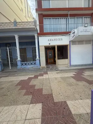 an empty street in front of a building at Apartamento amanecer paseo marítimo in Cullera