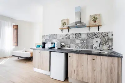 a kitchen with a sink and a counter top at The Port Urban Loft in Valencia
