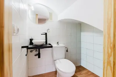 a bathroom with a toilet and a sink at Casa Las 4 Estaciones in Caudiel