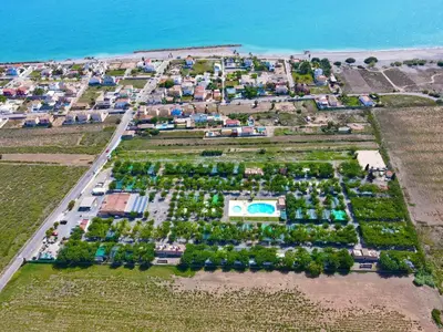an aerial view of a park next to the ocean at Camping Los Naranjos in Moncófar