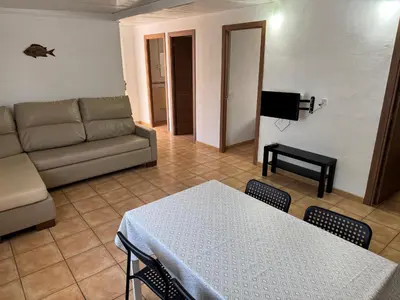 a living room with a couch and a table at Camping Los Naranjos in Moncófar