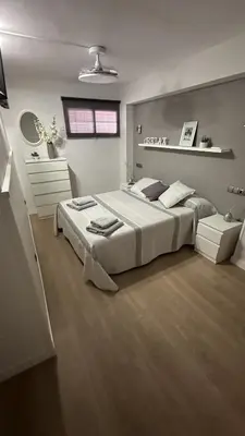 a large bedroom with a large bed in it at Apartamento Bahía Cullera I in Cullera