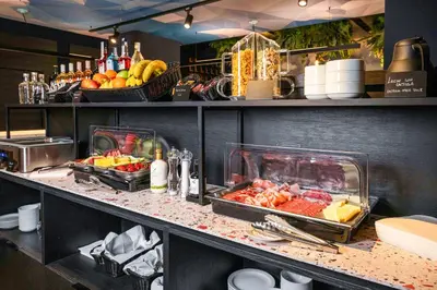 a kitchen with fruits and vegetables on a counter at Hotel Pathos by Mimood Aparthotels in Valencia