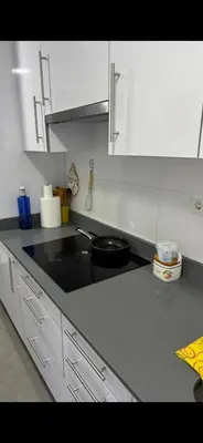 a kitchen with a counter top with a stove top oven at Mislata casa in Valencia