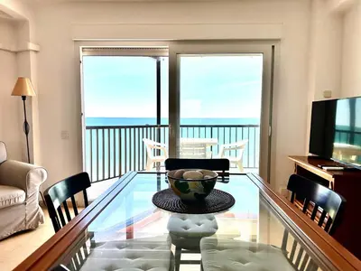 a living room with a glass table with a bowl on it at Vistas al mar, El Puig in El Puig