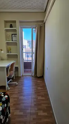 an office with a desk and a window with a view at Sagunto Beach Apartment 500m to Sea, WiFi 600Mb y AC in Puerto de Sagunto