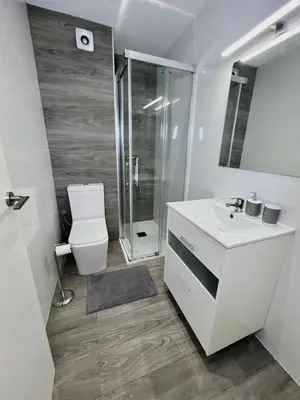 a bathroom with a toilet and a sink and a shower at Cullera Sea and Mountain Balcony in Cullera