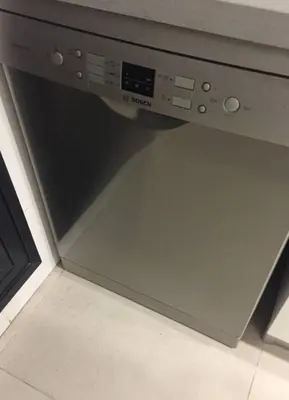 a close up of a dishwasher in a kitchen at Apartment 300 m from the beach ,parking , breakfast in Valencia