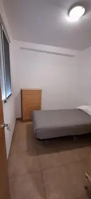 a bedroom with a bed in a room at Apartamento Cervantes in Benetúser