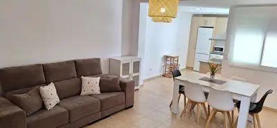 a living room with a couch and a table at Apartamento Cervantes in Benetúser