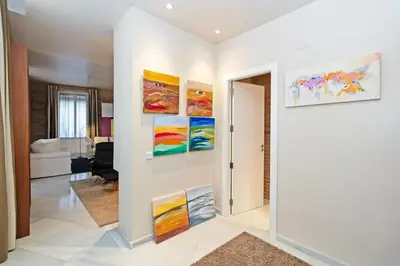 a living room with paintings on the walls at GuestReady - Charming place in Valencia in Valencia