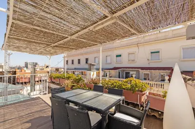 a table and chairs on the roof of a building at GuestReady - Charming place in Valencia in Valencia