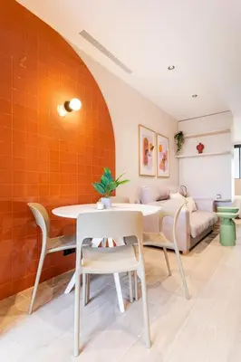 a living room with a table and a couch at Lujoso apartamento en Ruzafa in Valencia