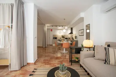 a living room with a couch and a table at SingularStays Palau de la Musica Lofts in Valencia