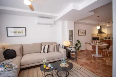 a living room with a couch and a table at SingularStays Palau de la Musica Lofts in Valencia