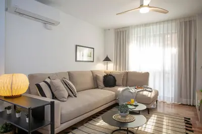 a living room with a couch and a table at SingularStays Palau de la Musica Lofts in Valencia