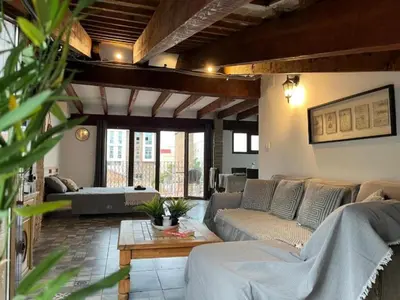 a living room with couches and a coffee table at Penthouse with two terraces near the sea in Valencia