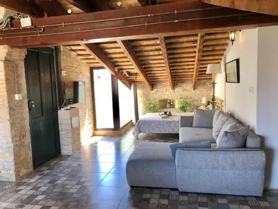 a large living room with a couch and a bed at Beautiful penthouse with two terraces near the sea in Valencia