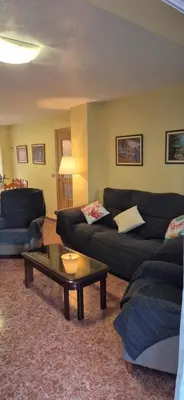 a living room with two couches and a coffee table at A fantastic apartment on the beach in Canet de Berenguer