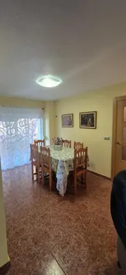 a dining room with a table and chairs at A fantastic apartment on the beach in Canet de Berenguer