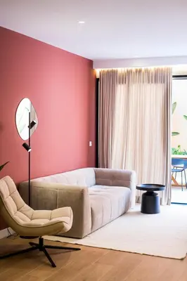 a living room with a couch and a chair at Apartamento moderno con terraza en el centro in Valencia