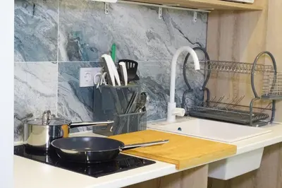 a kitchen counter with a frying pan on a stove at DM1 - Loft Valencia in Valencia