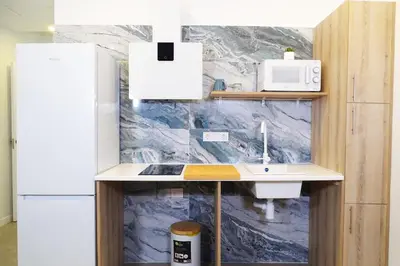 a kitchen with a sink and a refrigerator at DM1 - Loft Valencia in Valencia