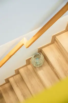 a wooden staircase with a bowl on the floor at Valencia Beach Luxury Penthouse, Late Checkout in Valencia