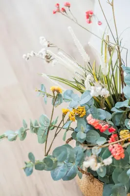 a vase filled with flowers and plants at Valencia Beach Luxury Penthouse, Late Checkout in Valencia