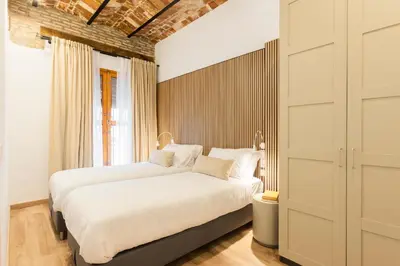 a bedroom with two beds and a window at Luxury apartament, close to Cabañal Beach, Late Checkout in Valencia