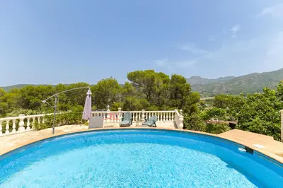 a swimming pool with a view of the mountains at Chalet Barraca d 'Aigües Vives in Barraca de Aguas Vivas