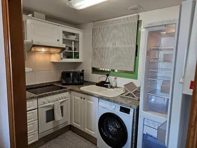 a bathroom with a toilet and a sink and a tub at Apartamento Brisa Patacona in Valencia