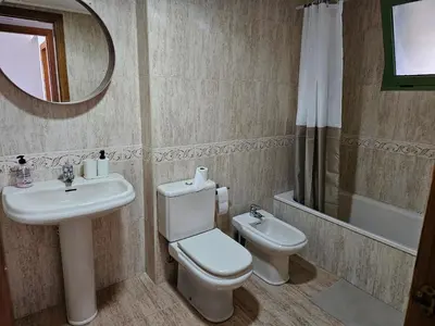 a living room with a couch and a table at Apartamento Brisa Patacona in Valencia
