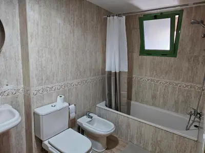 a bedroom with a bed with a view of the ocean at Apartamento Brisa Patacona in Valencia