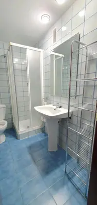 a bathroom with a sink and a mirror and a toilet at Valencia verano in Valencia