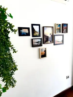 a group of pictures on a white wall at Apartment 100m from the beach in Cullera