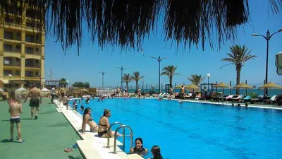 a group of people in a swimming pool at a resort at Charming Coastal Retreat in Alboraya
