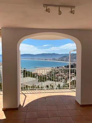 a view of the ocean from a balcony at Vila 